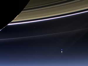 image credit: NASA/JPL-Caltech/Space Science Institute; <a href="http://www.jpl.nasa.gov/news/news.php?release=2013-229" target="_blank">image source</a>; <a href="http://www.physicstogo.org/images/features/Saturn-Earth-large.jpg" target="_blank">larger image</a>